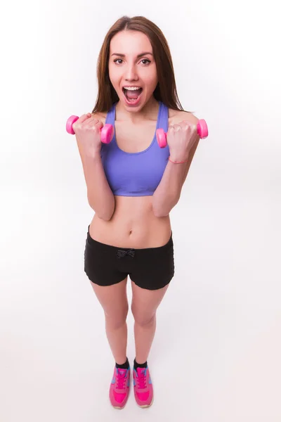 Aktivní sportovní atletické žena s činkami se svaly biceps čerpání — Stock fotografie