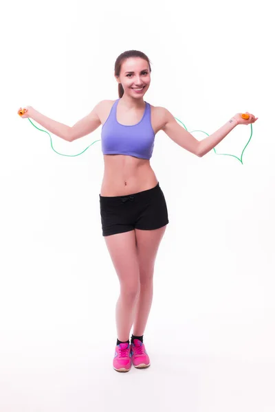 Woman with healthy sporty figure with skipping rope — Stock Photo, Image