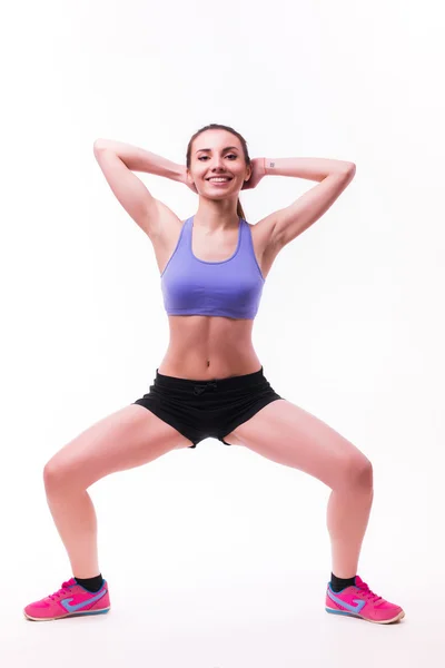 Mujer joven haciendo ejercicio físico — Foto de Stock