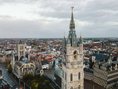 Expansive drone view capturing the skyline of Ghent with its famous medieval towers.