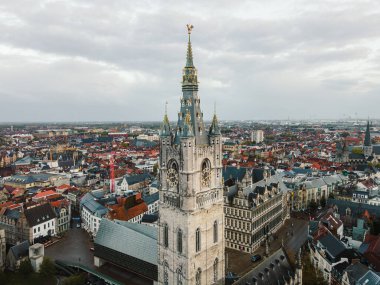 Aerial panorama of Ghent featuring the iconic Belfry tower and the rooftops of the old city.