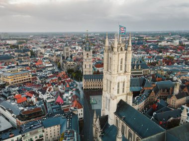 Aerial footage showcasing Ghents gothic towers and dense urban heritage below