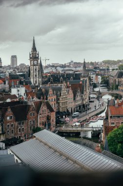 Sweeping view from Gravensteen Castle over Ghents rooftops, towers, and cobblestone streets.