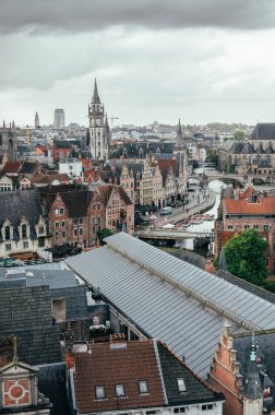 Beautiful cityscape from Gravensteen Castle capturing Ghents rooftops and distant towers.