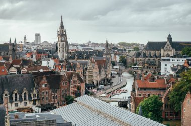 Elevated scene from Gravensteen Castle overlooking traditional Belgian houses and narrow streets.