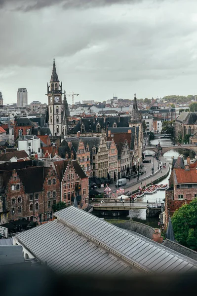 Sweeping view from Gravensteen Castle over Ghents rooftops, towers, and cobblestone streets.