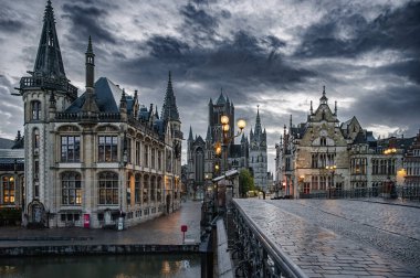 Ghent, Belgium - October 5, 2025 - Old city buildings reflected in calm canal waters in the historic center of Ghent