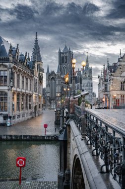 Ghent, Belgium - October 5, 2025 - Gently curving canal surrounded by charming historic architecture in Ghent.