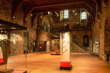 Ghent, Belgium - October 5 2025: Medieval interior of Gravensteen Castle in Ghent, Belgium, featuring stone walls, arched windows, and historical atmosphere from the Middle Ages.