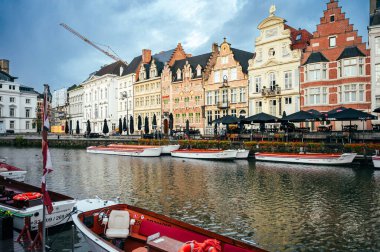 Ghent, Belgium - October 5, 2025 - Picturesque canal in Ghents old town framed by ancient stone houses and soft reflections.