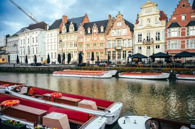 Ghent, Belgium - October 5, 2025 - Classic European canal view with stone bridges and old buildings along the waterfront.