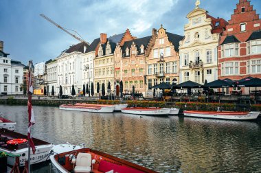 Ghent, Belgium - October 5, 2025 - Scenic corner of Ghent where narrow canals meet under charming bridges and brick walls.