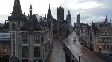 Drone footage highlighting Ghent historic skyline with ancient towers and narrow streets.