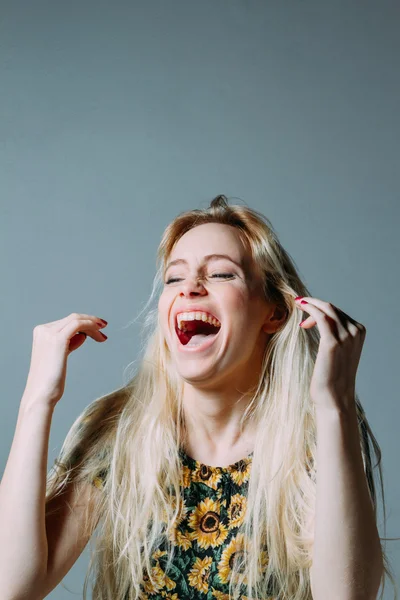 Blonde woman laughing out loud — Stock Photo, Image