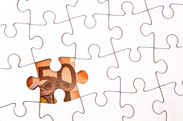 Euro-Geldschein unter Puzzle — Stockfoto