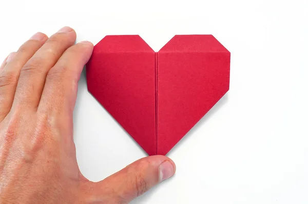 Ruka Origami srdce — Stock fotografie