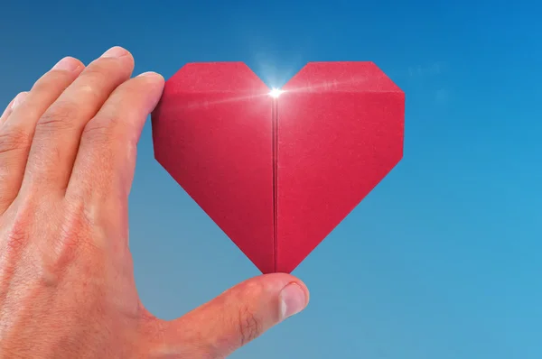 Origami srdce v ruce — Stock fotografie