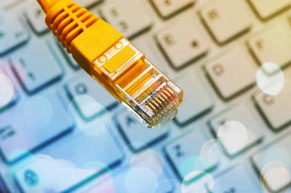 Macro of a yellow network cable — Stock Photo, Image