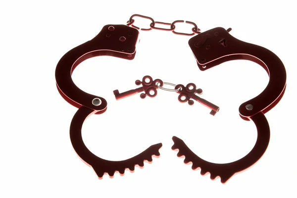 Red handcuffs as a sex toy — Stock Photo, Image