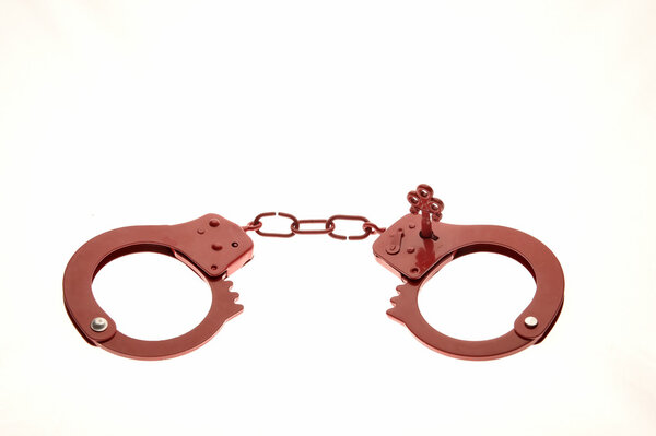 Red handcuffs as a sex toy