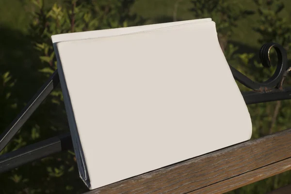 MockUp of the newspaper on a bench — Stock Photo, Image