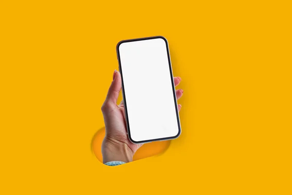 Woman Holding Hand Smartphone Blank Screen Isolated Yellow Background Creative — Stock Photo, Image