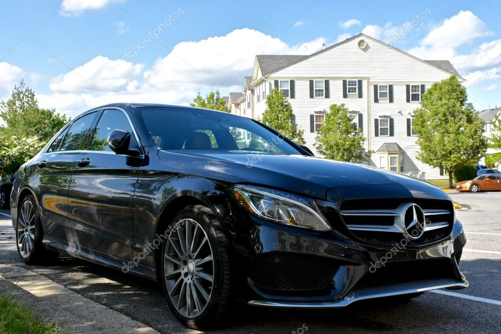 MARYLAND, USA - MAY 7, 2016: A black Mercedes Benz C400. Mercedes Benz is a luxury car dealer and manufacturer.