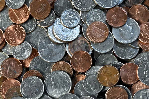 Coins laying in a pile — Stock Photo, Image