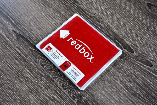 Redbox Dvd na povrchu dřeva — Stock fotografie