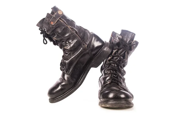 Old black combat boots on white background — Stock Photo, Image