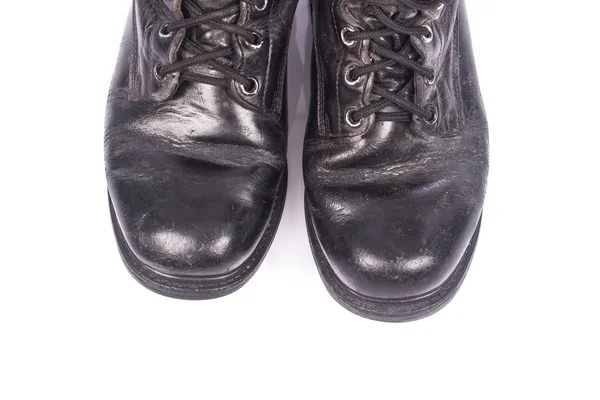 Old black combat boots on white background — Stock Photo, Image