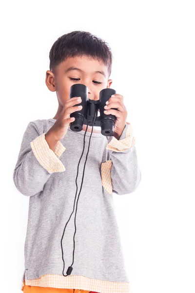 Malý chlapec při pohledu přes dalekohled — Stock fotografie