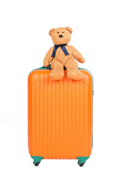 Suitcases and brown teddy bear on white background — Stock Photo, Image