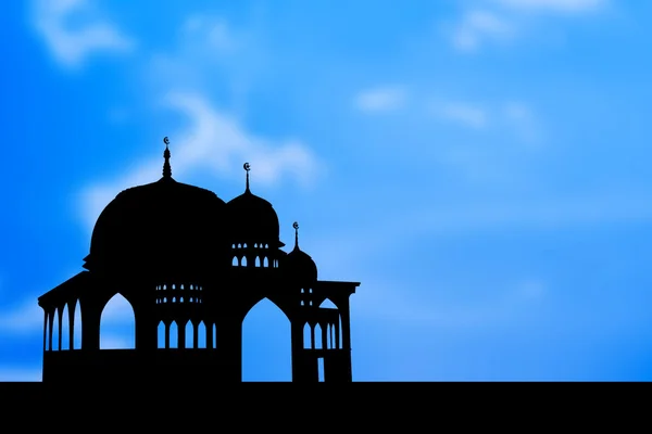 Silhouet van moskee op blauwe achtergrond — Stockfoto