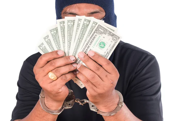 Dieb hält in Handschellen Geld in der Hand — Stockfoto