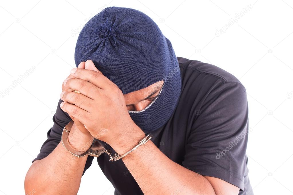 Young man suspect hand in handcuff