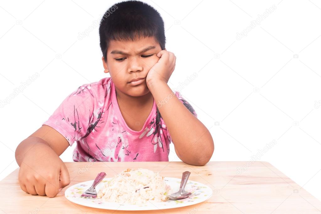 Cute little boy bored with food
