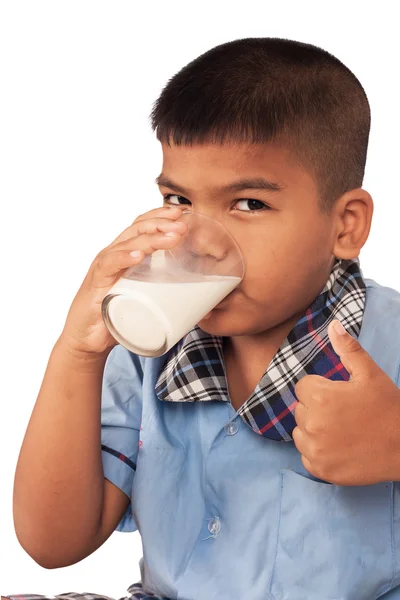 Школярка п'є молоко і лафет — стокове фото