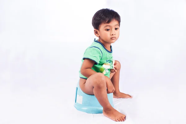 Little asian boy defecate on white background — Stock Image Little asian boy defecate on white background Stock Photo