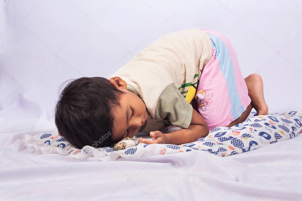 little asian boy sleep on white background
