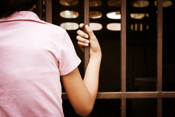 Hand girl hold jail ivtage tone — Stock Photo, Image