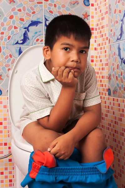 Little asian boy defecate in toilet background — Stock Image Little asian boy defecate in toilet background Stock Picture