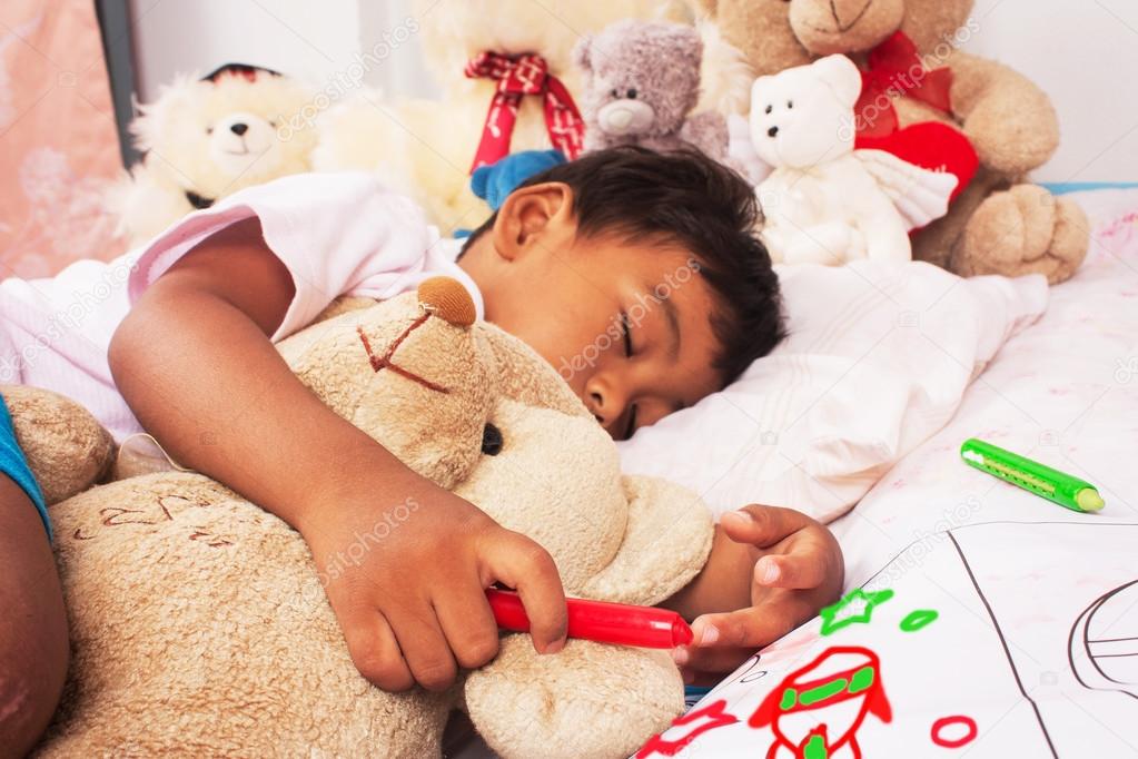 A Little Asian Boy Sleep With Teddy Bear And Hand Hold Crayon fo a-little-asian-boy-sleep-with-teddy-bear-and-hand-hold-crayon-fo