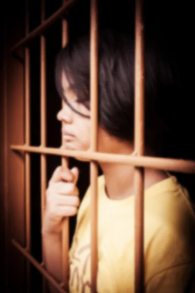 Vintage of blurry of asian girl Hand in jail — Stock Photo, Image