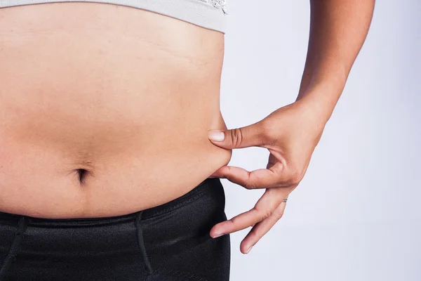 Γυναικών λίπος στην κοιλιά σώμα πρόσοψη — Φωτογραφία Αρχείου