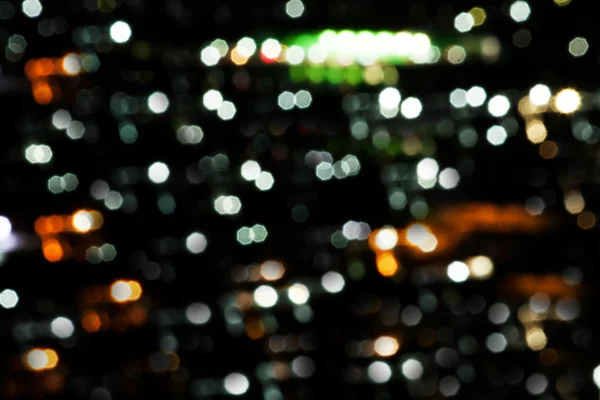 Aclarar abstracto borroso en la ciudad por la noche —  Fotos de Stock