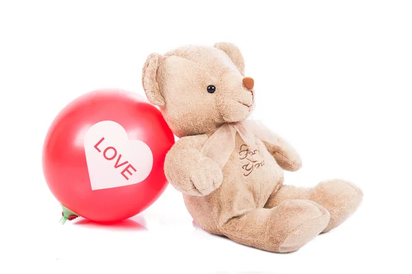 Urso de pelúcia com balão vermelho — Fotografia de Stock