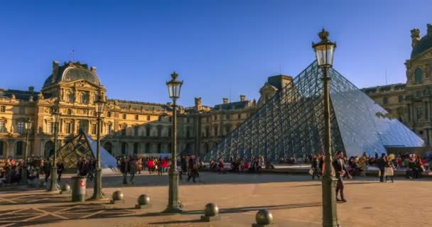 Louvre pyramid shines shot of day to night — Stock Video