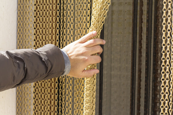 Hand pushing metal courtain