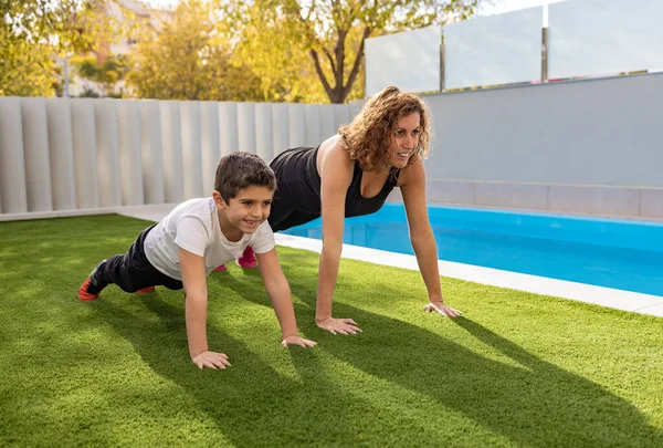 Mother Son Doing Exercise Home Garden — Stock Photo, Image